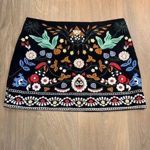 Mini black skirt with floral sequence